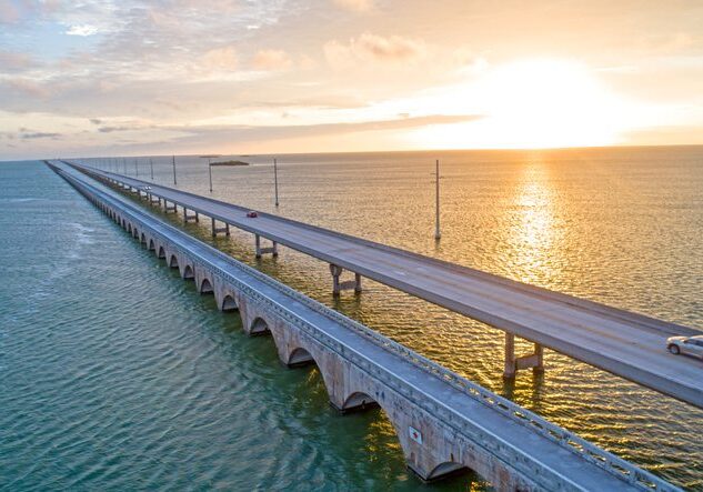 Overseas Highway Seven Mile Bridge Traffic at Sunrise. View From Florida Keys Tropical Road to Paradise